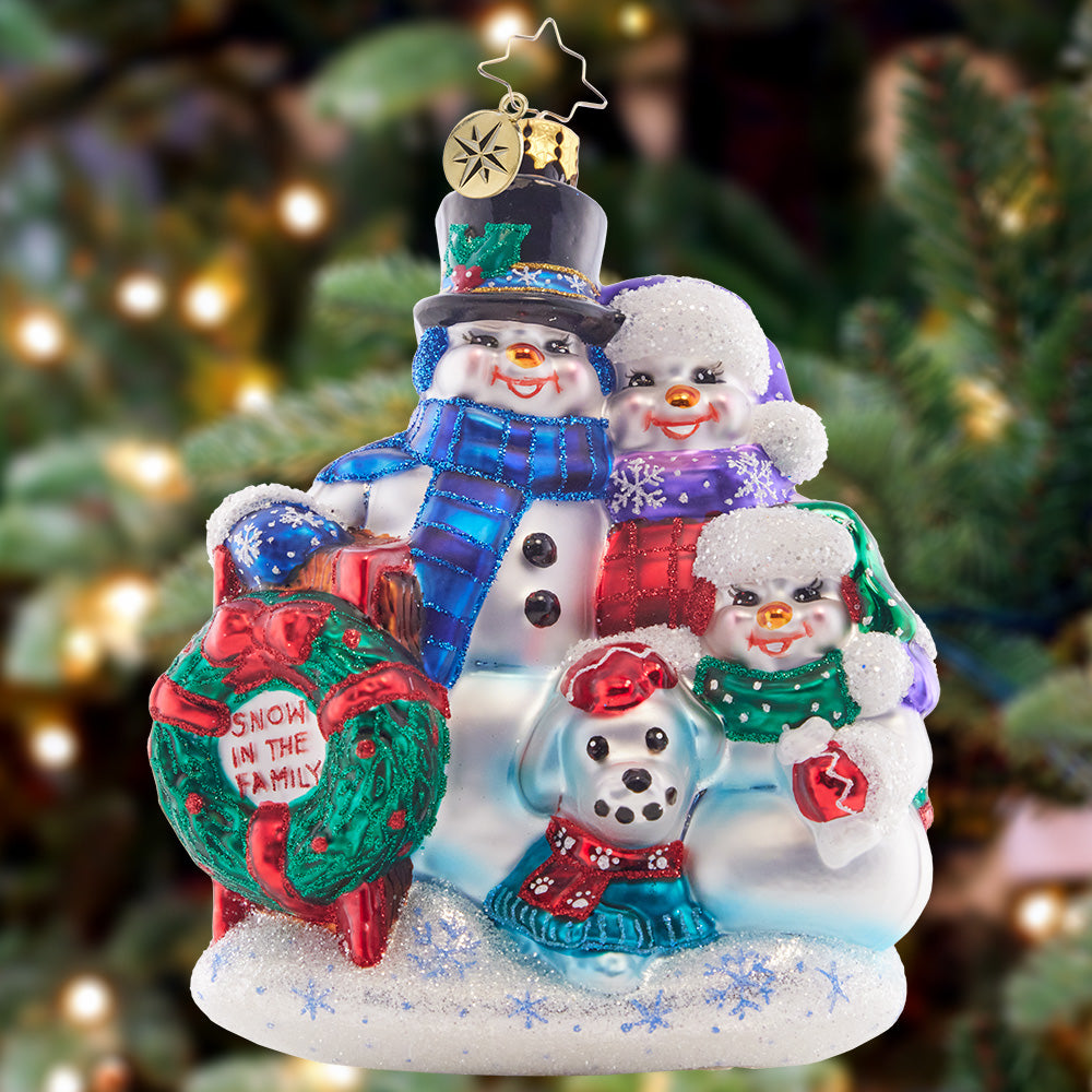 Ornament Description - Snow in the Family: A happy snow family celebrates holiday traditions in this adorable ornament edition. Gathered together they'll share in the holiday cheer to celebrate another great year!