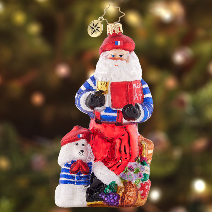 Ornament Description - Pardon My French Santa: Bon jour, Santa Claus! This Santa is looking perfectly posh and Parisian, complete with a bundle of baguettes and a poodle puppy. Joyeux Noel, indeed!