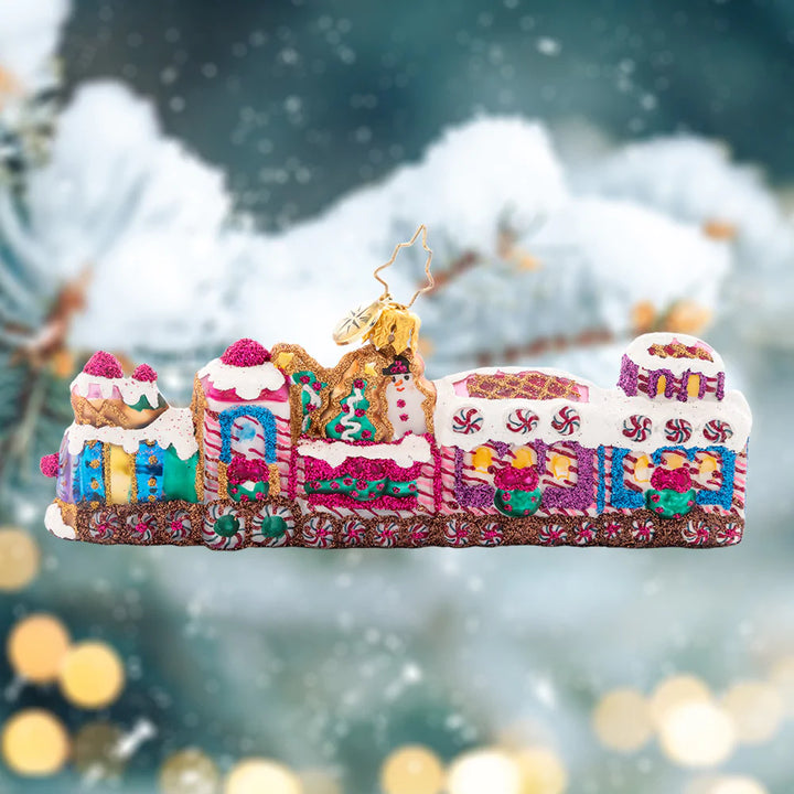 Ornament Description - Sweet Treat Express: All aboard the candy-covered choo choo train! Glistening with gumdrops, peppermints, and radiant-white royal icing, this sweet ride is the perfect transport to your holiday destination.