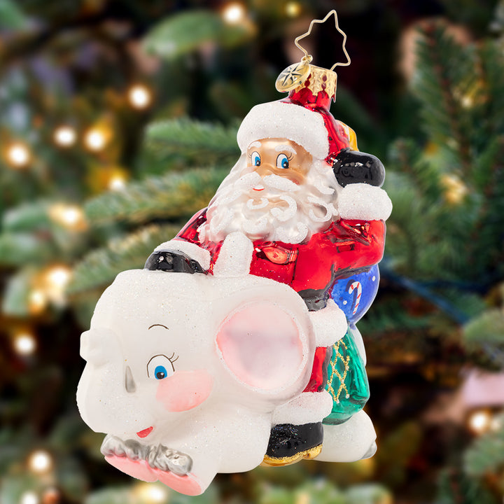 Ornament Description - White Elephant Christmas: What will Santa bring to the gift exchange? A whimsical white elephant, of course! This clever ornament highlights a Christmas tradition celebrated by many.