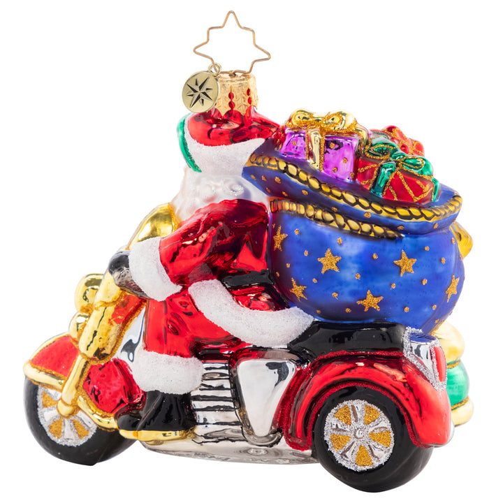 Back - Ornament Description - Santa's Sidecar Sidekick: The Clauses are dressed alike and going for a ride on Santa's Christmas motorbike. It was time to give the reindeer a break from all their delivery hoof aches.