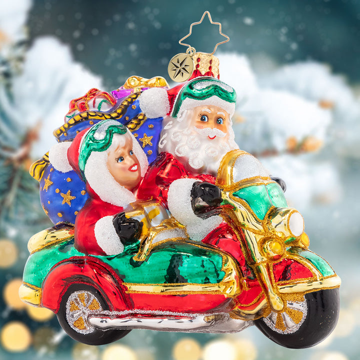 Ornament Description - Santa's Sidecar Sidekick: The Clauses are dressed alike and going for a ride on Santa's Christmas motorbike. It was time to give the reindeer a break from all their delivery hoof aches.
