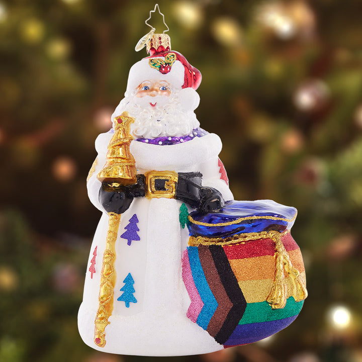 Ornament Description - Pride of Christmas: Santa celebrates progress & PRIDE all year in full stride! With gifts for all his LGBTQIA+ friends, he'll always be one you can depend on. A percentage of the sales from this ornament will benefit LGBTQ+ charities.