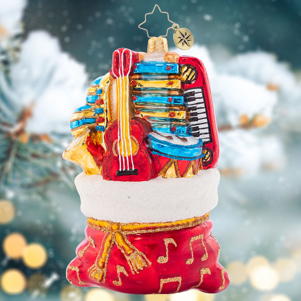 Ornament Description - Band in a Bag: A whole Band in a Bag gives is full of wondorous talent for you to brag. This musical group is ready to play and celebrate a very special day!