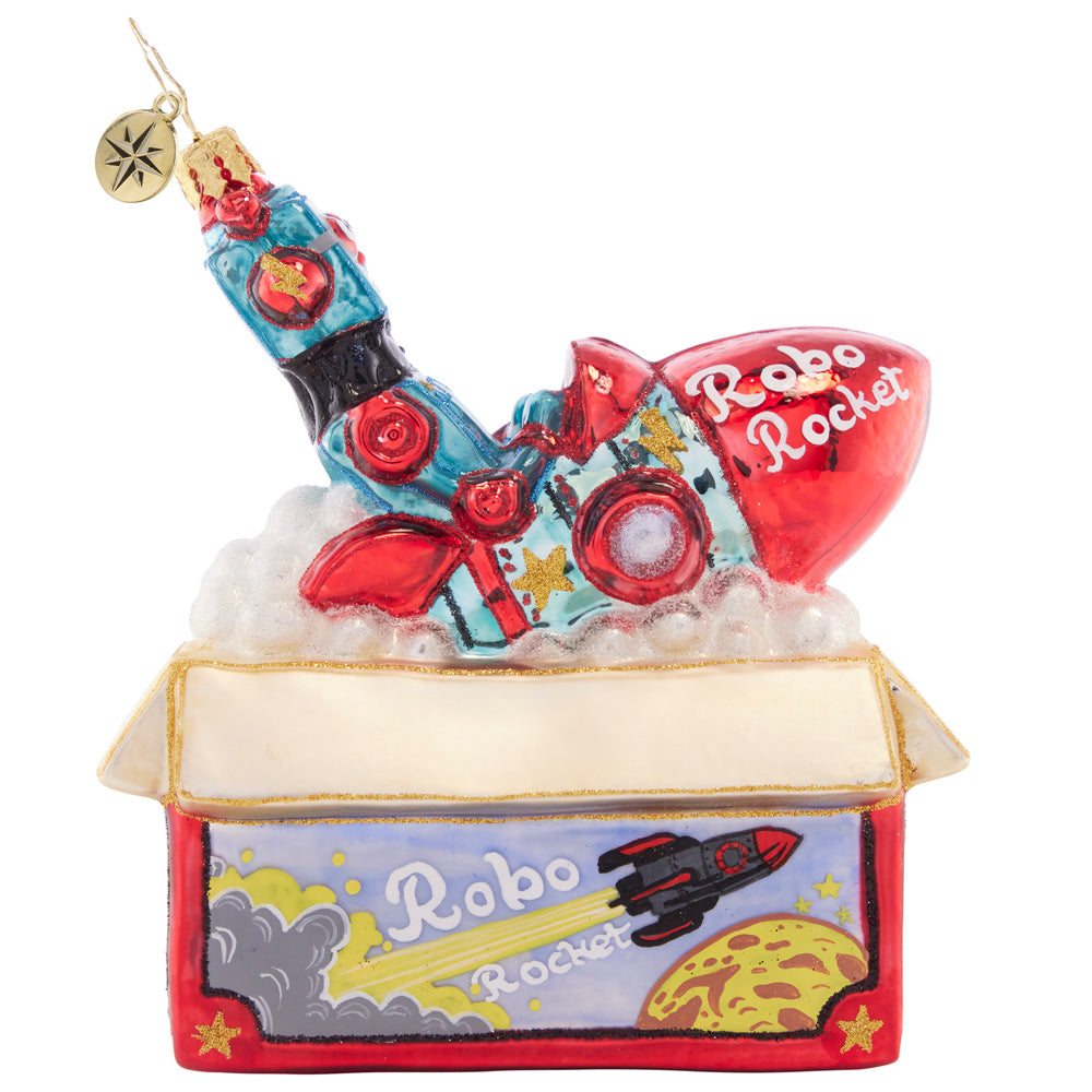 Front - Ornament Description - Robo Rocket Rides Again: Bursting from the box, this red robo-rocket toy is just begging to be played with on Christmas morning! This ornament evokes nostalgic memories of the of childhood holiday gifts.