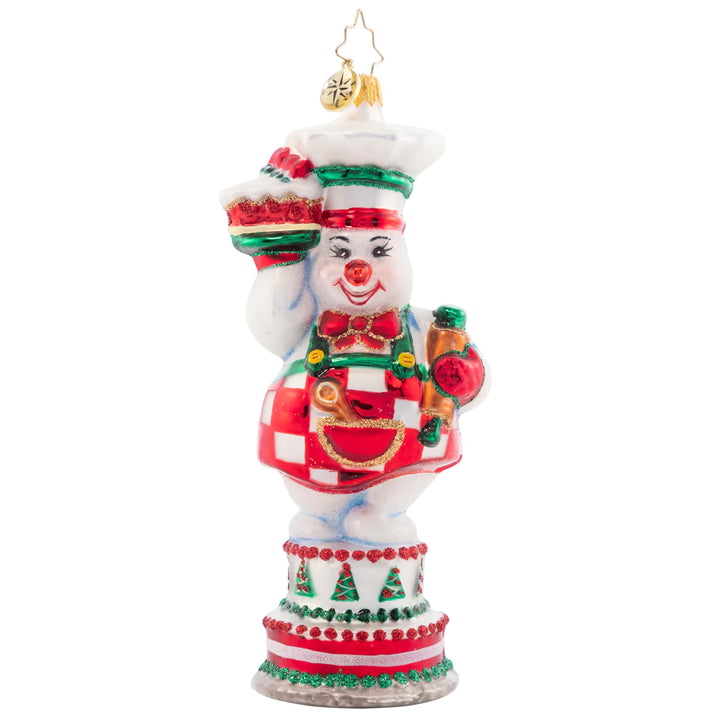 Front - Ornament Description - Cutie Pie Baker: This darling snow pal is the greatest cake maker. She uses cool icicle frosting so these baked goods are never defrosting. Join in the feast of this delicious sweet treat!