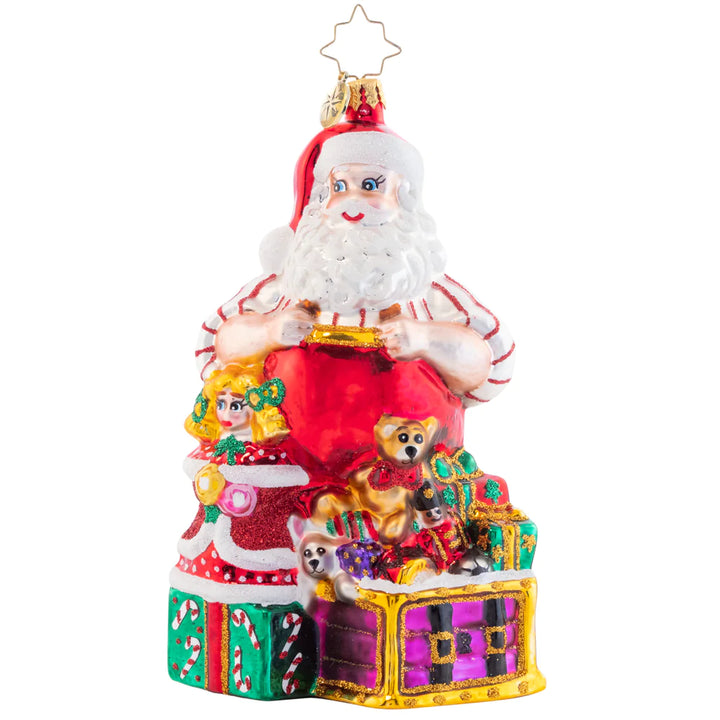 Ornament Description - Toys To Go Santa: The elves have worked their hardest as wonderful toy artists! Santa is fully stocked with treasures galore. You'll never have to ask for more.