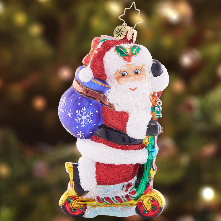 Ornament Description - Scootin' Claus: Santa scoots along in style with this Christmas-colored ride. He's the coolest thing on two wheels this holiday season!