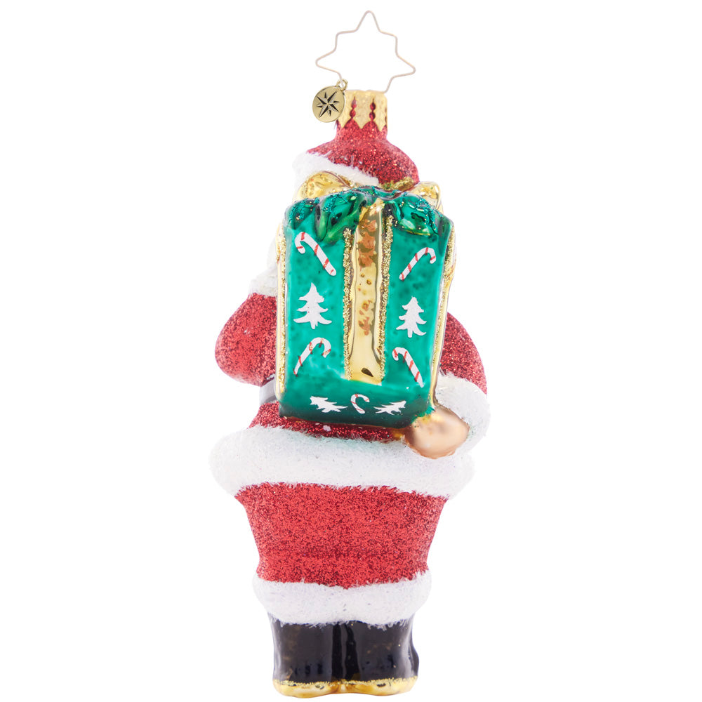 Back - Ornament Description - Santa's Big Surprise: Looks like Santa has a secret – a glorious green gift hidden behind his back! He's ready to share the Christmas cheer by presenting this well-packed parcel.