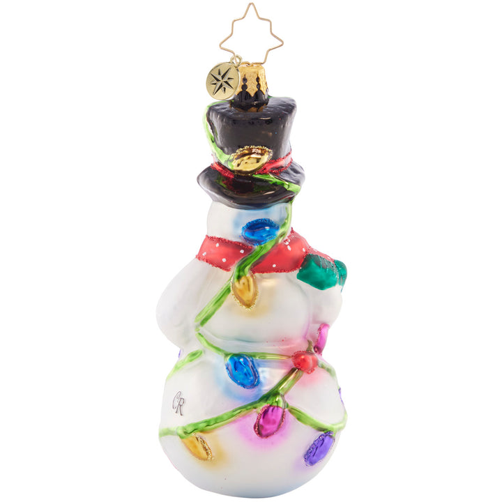 Back - Ornament Description - Light The Night Snowman: This smiling snowman has his work cut out for him with a big bundle of holiday lights – ready to deck the halls and shine bright through the night!