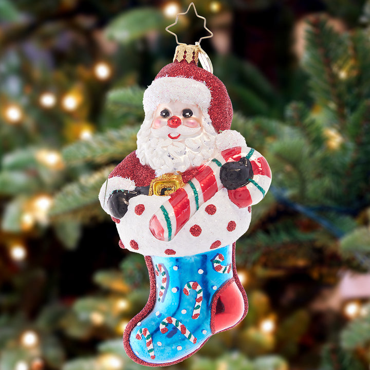 Ornament Description - Love is The Best Medicine: Santa brings Christmas cheer to let you know that he is near. He'll never leave your side and comfort you this yuletide. A portion of the proceeds from the sale of this ornament will be donated to an organization supporting pediatric cancer awareness.