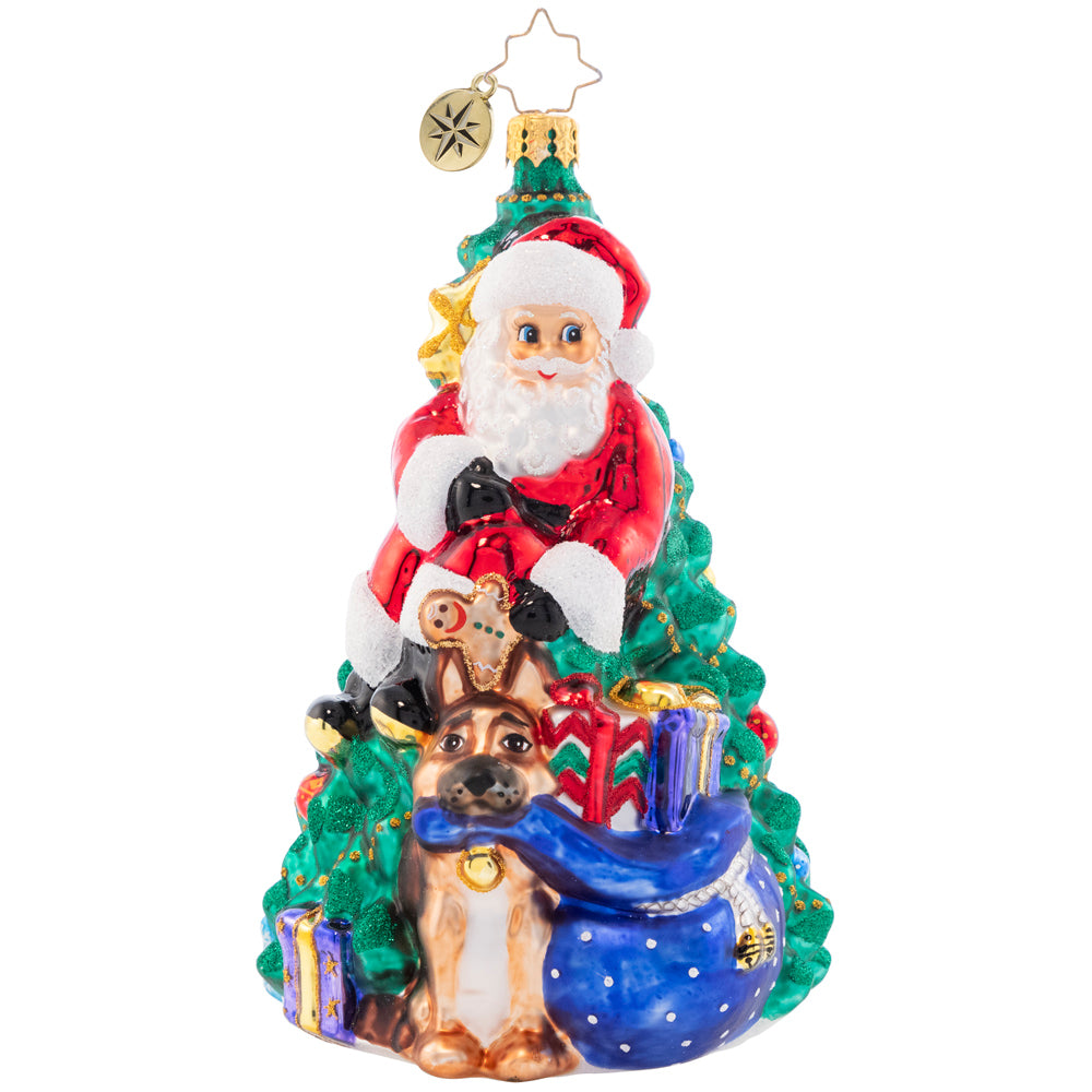 Front - Ornament Description - Santa's Best Friend - 2023: What better way to celebrate Christmas than with your best furry friend? Santa and Fido gather 'round the tree, ready to open presents and enjoy a cheerful holiday.