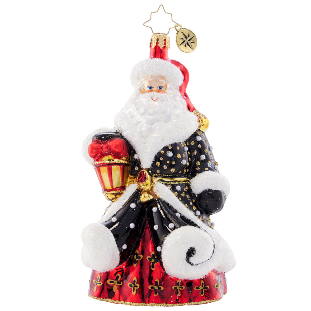 Front - Ornament Description - Golden Glow Santa: Santa's black robe is studded with silver and gold, resembling a starry sky on a cold winter night. He's got his trusty lamp to light the way this holiday season.