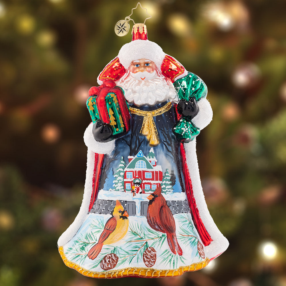 Ornament Description - Santa's Snowy Scene - 2023!: Stunning as ever in a star-studded coat, Santa turns to reveal a beautiful snowy Christmas scene. Two little birds perch outside of a cozy cottage, waiting to see what Santa brought for Christmas!