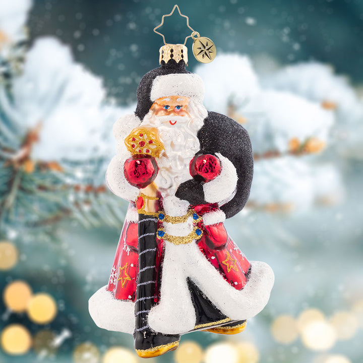 Ornament Description - Jolly Jewel-Toned Santa: Jauntily-dressed in a jewel-toned jacket and stylish black hat, Santa strolls along to make his next gift delivery! Sure to stand out, add this unique piece to your ornament collection this year.