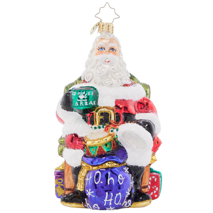 Front - Ornament Description - Break Time Santa: Hats off to a much needed coffee break! Santa takes a moment to sit back and relax with a steaming hot cup of joe before returning to his important present wrapping tasks.