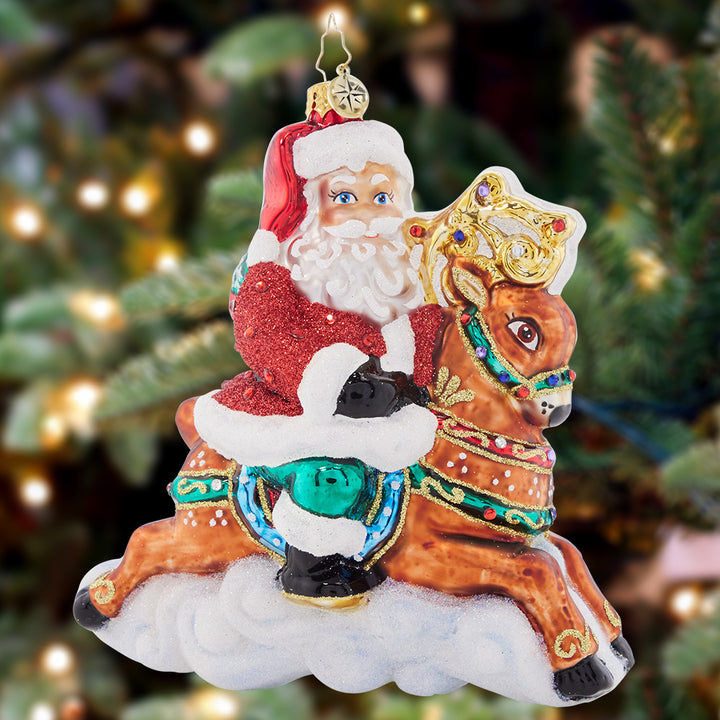 Ornament Description - Giddy Up Santa: Santa is priming his reindeer for a speedy sleigh ride on Christmas Eve, so he's going out for a test run with dashing Donner! They're fiending to fly through the holiday night sky.