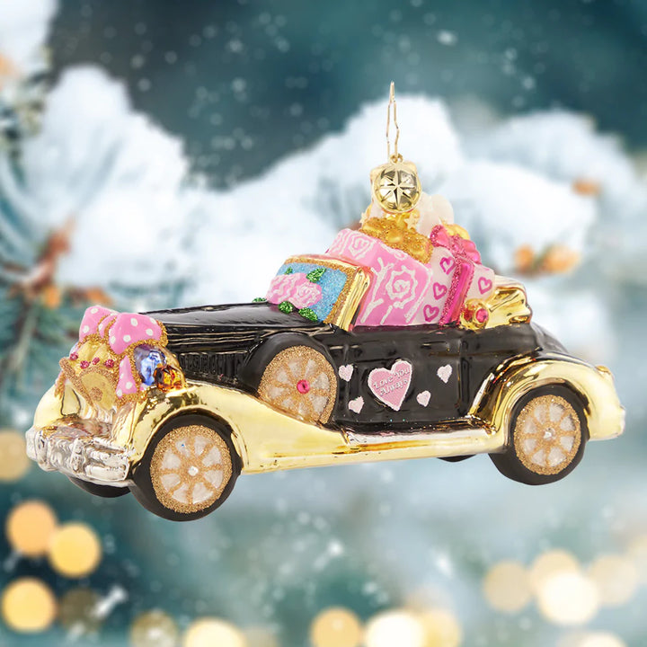 Ornament Description - Just Married Roadster: If you see this heart-covered automobile driving down the road, you know what that means… A happy couple just got hitched! Honor the newlyweds in your life with this sweet ride.