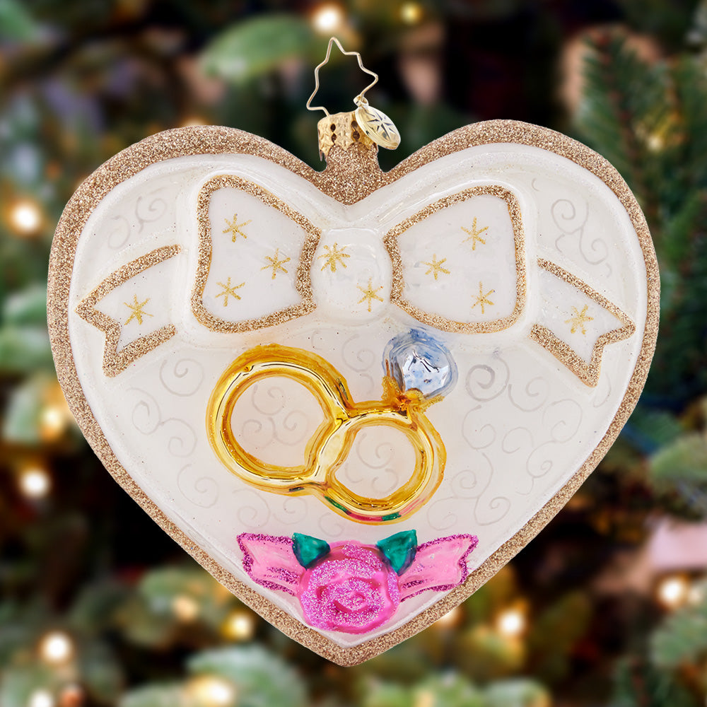 Ornament Description - Love Everlasting: Linked together in a symbol of everlasting love and unity, these golden rings celebrate the timeless tradition of marriage.