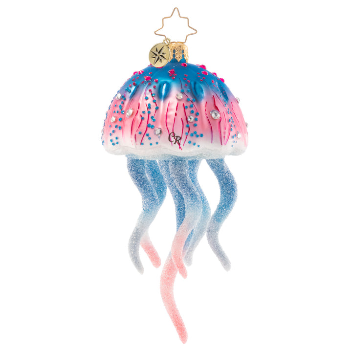 Back - Ornament Description - Colorful Jelly: This joyful jellyfish is a jubilee of pink and blue hues. Let this stunning sea creature float among the boughs of the tree, bringing nautical cheer for all to see!