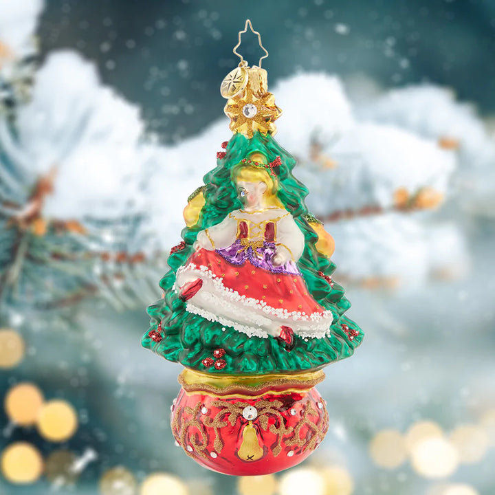 Ornament Description - Dancing Delight: A dancing lady bounds across one side of the tree, while a pair beautiful bow-tied ballet slippers adorn the other. Celebrate musical magic with this intricate ornament.