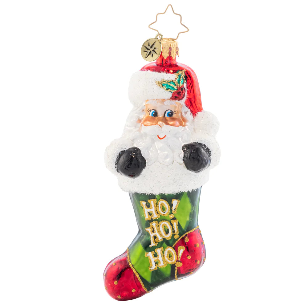 Front - Ornament Description - Stocking Stuffed Santa: Surprise! This Santa-stuffed stocking is the most perfect gift of all. Decorated with green argyle and Santa's signature jolly laugh, this ornament is sure to bring joy to your tree this year.