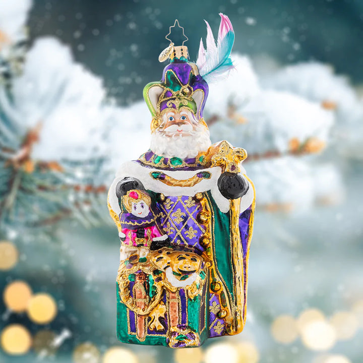 Ornament Description - Mardi Gras Claus: Santa is donning his festive feathered hat and traditonal Fleur de Lis, celebrating Christmas with a magical Mardi Gras flair.