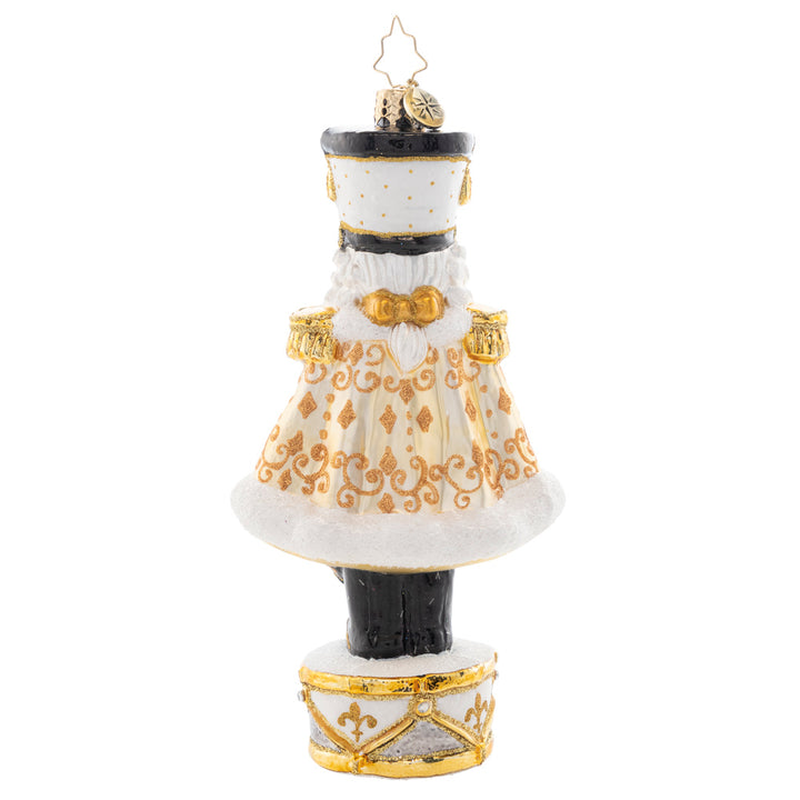 Back - Ornament Description - Golden Guardian: Gleaming and bold in white and gold, this Nutcracker is guarding the gift of Noel. Decorate your tree with this superbly stunning piece.