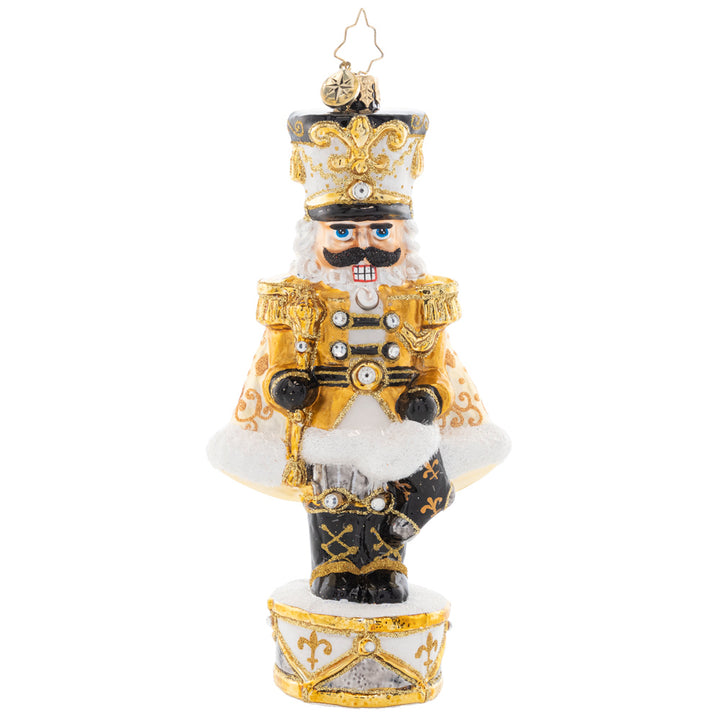 Front - Ornament Description - Golden Guardian: Gleaming and bold in white and gold, this Nutcracker is guarding the gift of Noel. Decorate your tree with this superbly stunning piece.