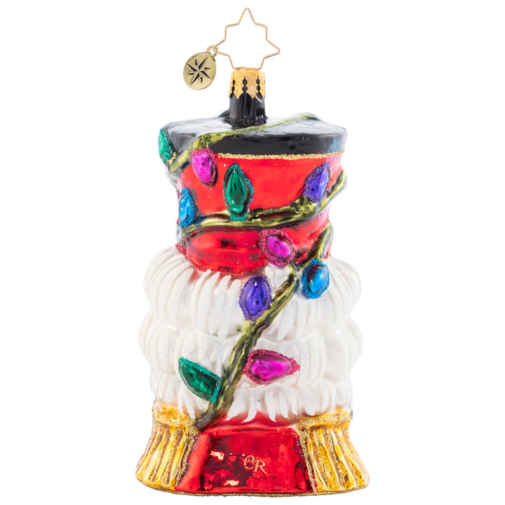 Back - Ornament Description - Bright Light Nutcracker: With colorful Christmas lights twisted around his tall top-hat, this Nutcracker "cracks" the best smile he's got – brightening up your tree in more ways than one!