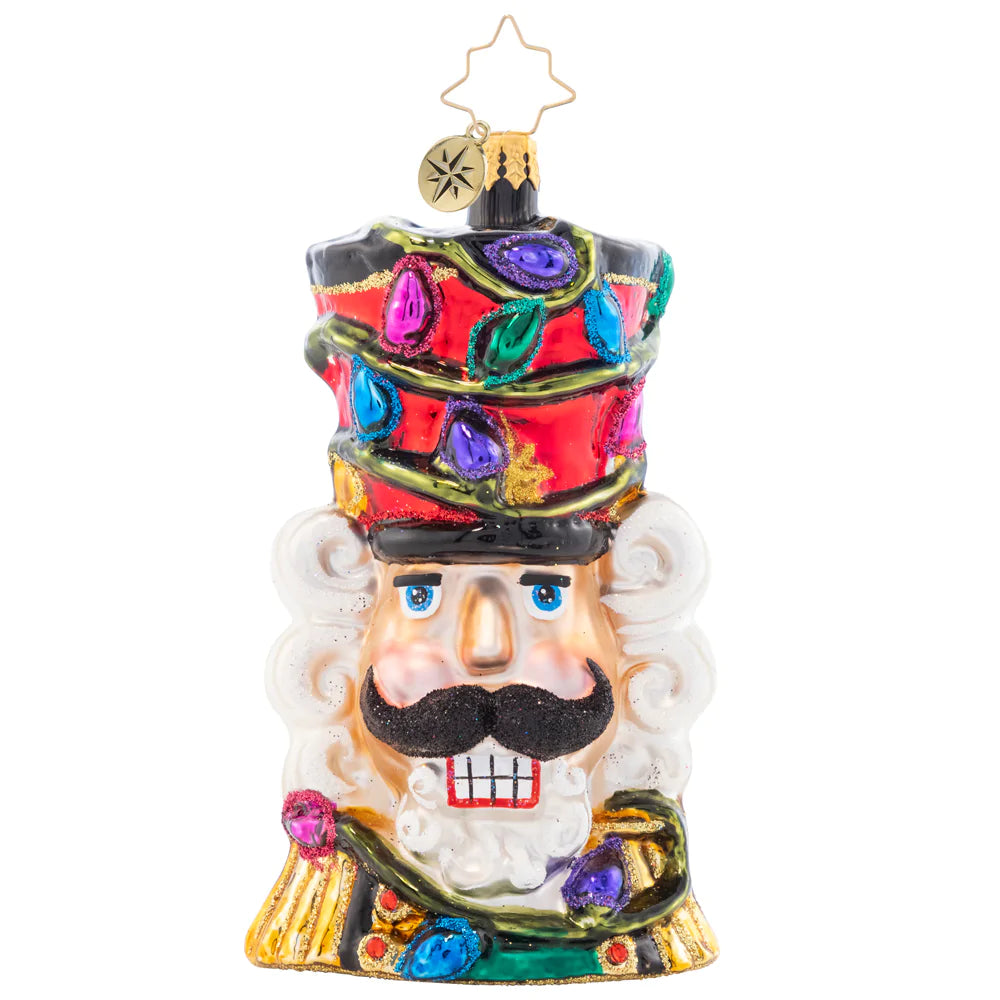 Ornament Description - Bright Light Nutcracker: With colorful Christmas lights twisted around his tall top-hat, this Nutcracker "cracks" the best smile he's got – brightening up your tree in more ways than one!