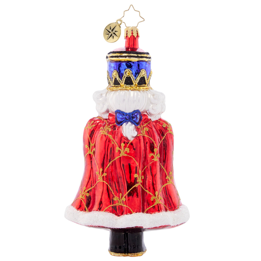 Back - Ornament Description - Holiday Elegance Nutcracker: With his royally resplendant red cape, this classic Christmas nutcracker is the perfect protector to place among the boughs of your tree.