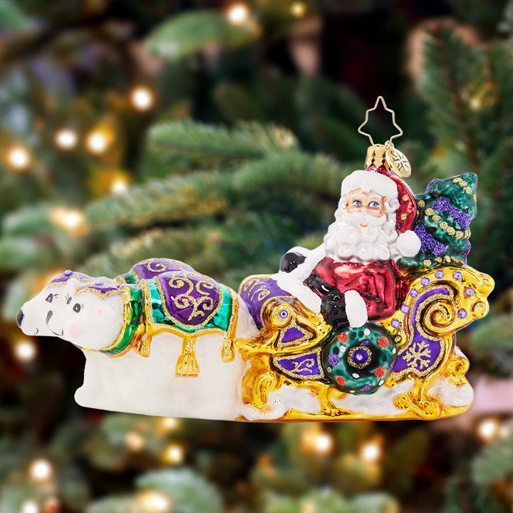 Ornament Description - Polar Pals Sleigh Ride: Although Santa takes to the skies with his team of reindeer, he relies on his polar bear pals to assist with ground transportation! Santa is surely speedy in his gilded Christmas sleigh.
