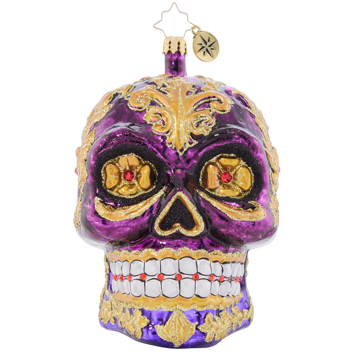 Front - Ornament Description - Festive Filigree Calavera: Looking fancy as ever with glowing golden eyes and stunning glittered swirls, this Calavera ornament is a frightfully festive piece to feature on your tree.