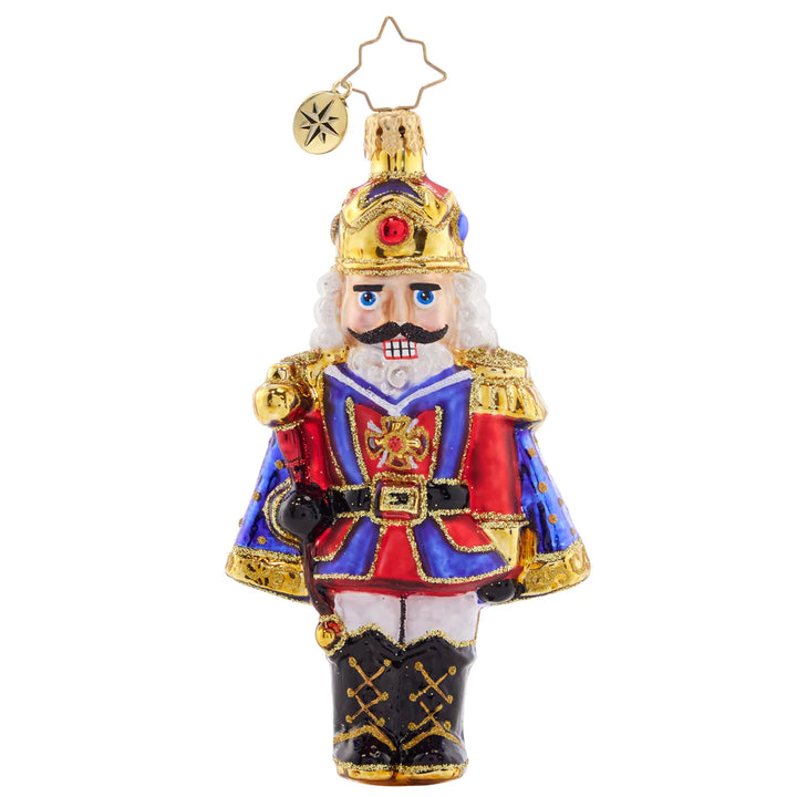 Front - Ornament Description - Christmas Classic 'Cracker: Time to get crackin' on some present unwrapping! This classic nutcracker is ready to celebrate, marvelously mustachioed and donning a red and blue cloak.