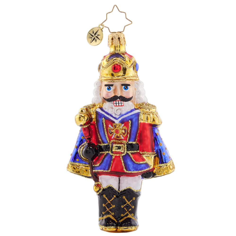 Front - Ornament Description - Christmas Classic 'Cracker: Time to get crackin' on some present unwrapping! This classic nutcracker is ready to celebrate, marvelously mustachioed and donning a red and blue cloak.
