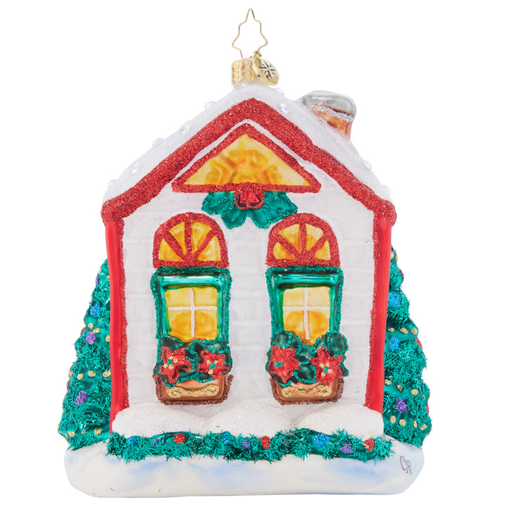 Back - Ornament Description - Santa's Holiday Home: After a winter whirlwind of delivering Christmas gifts, Santa is ready to relax at home for the remainder of the holiday season. Him and Mrs. Claus are nice and cozy in their cheerful cottage.