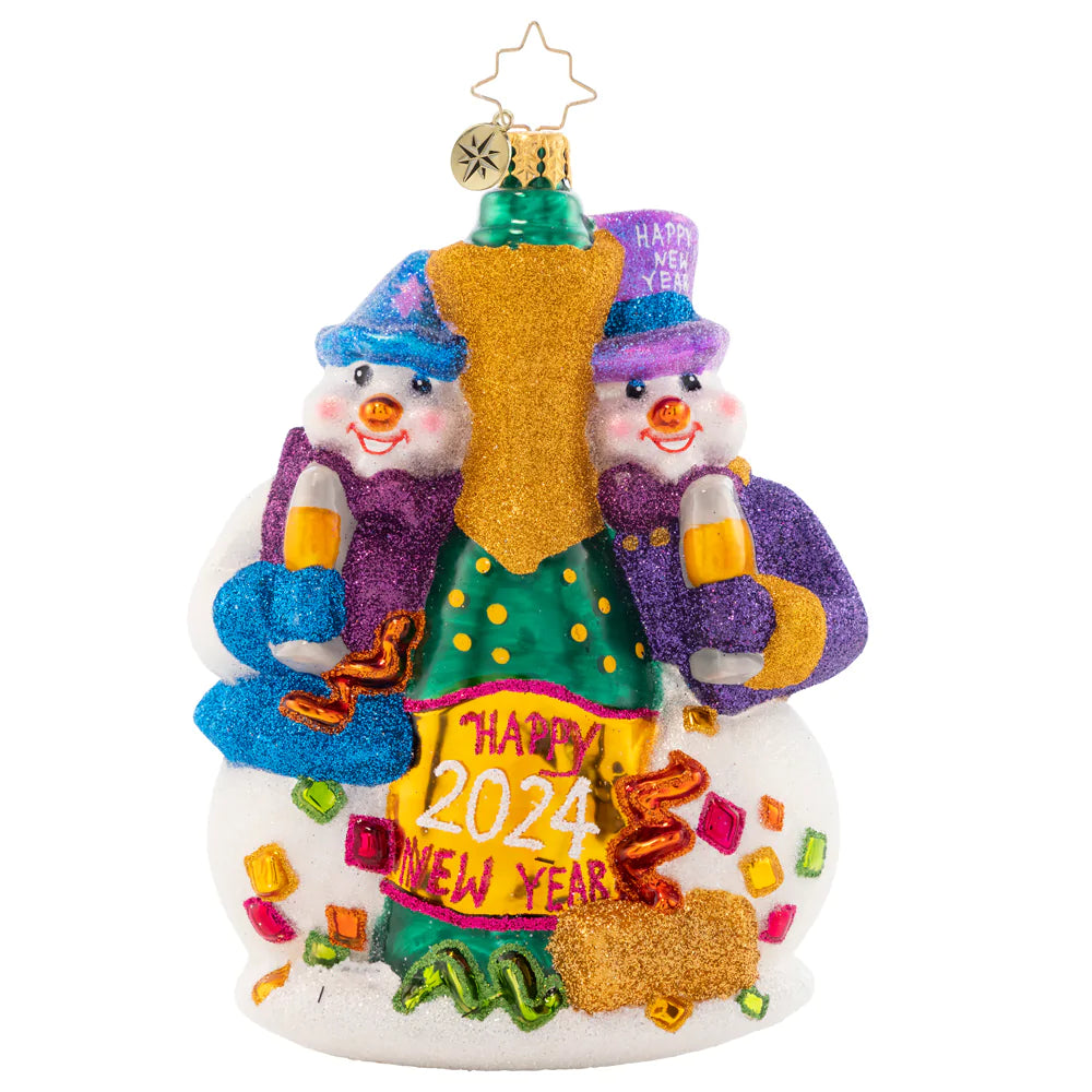 Front - Ornament Description - New Year's Toast: Two festive snow-friends are ringing in the new year with a big bottle of bubbly! Commemorate another wonderful year with this cute, cozy ornament.