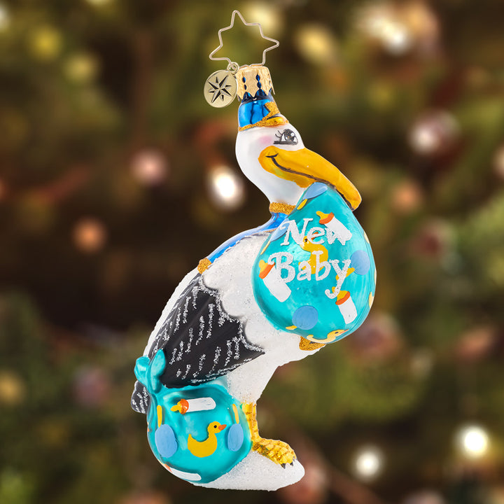 Ornament Description - Sweet Special Delivery: This smiling stork is flying in with a very special delivery this Christmas. Celebrate your precious little one with this adorable piece!