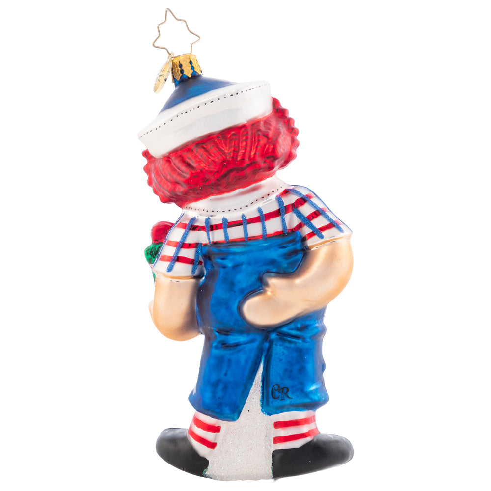 Back - Ornament Description - Raggedy Presents: The classic doll that everyone remembers comes to life this Christmas, with a bright smile and hope for jolly good holiday. Raggedy Andy even brought a present to place under the tree!