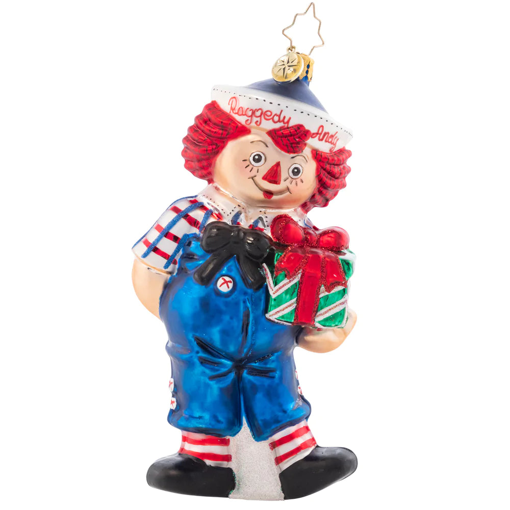 Front - Ornament Description - Raggedy Presents: The classic doll that everyone remembers comes to life this Christmas, with a bright smile and hope for jolly good holiday. Raggedy Andy even brought a present to place under the tree!