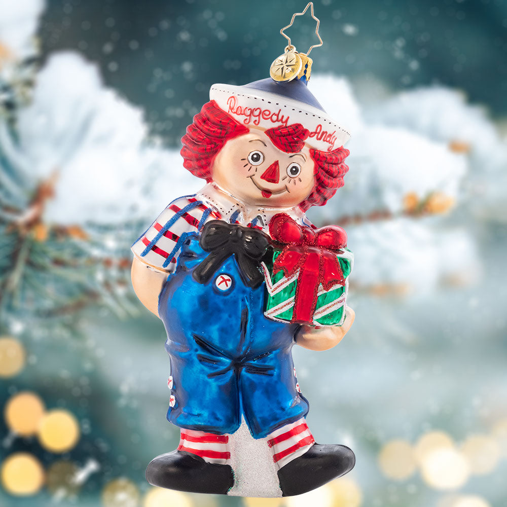 Ornament Description - Raggedy Presents: The classic doll that everyone remembers comes to life this Christmas, with a bright smile and hope for jolly good holiday. Raggedy Andy even brought a present to place under the tree!