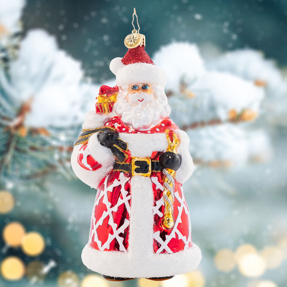 Ornament Description - Jeff's Jolly Gentleman: Jolly as ever just like Jeff Clark himself, this stylish Santa ornament is stunning in a crimson patterned coat.