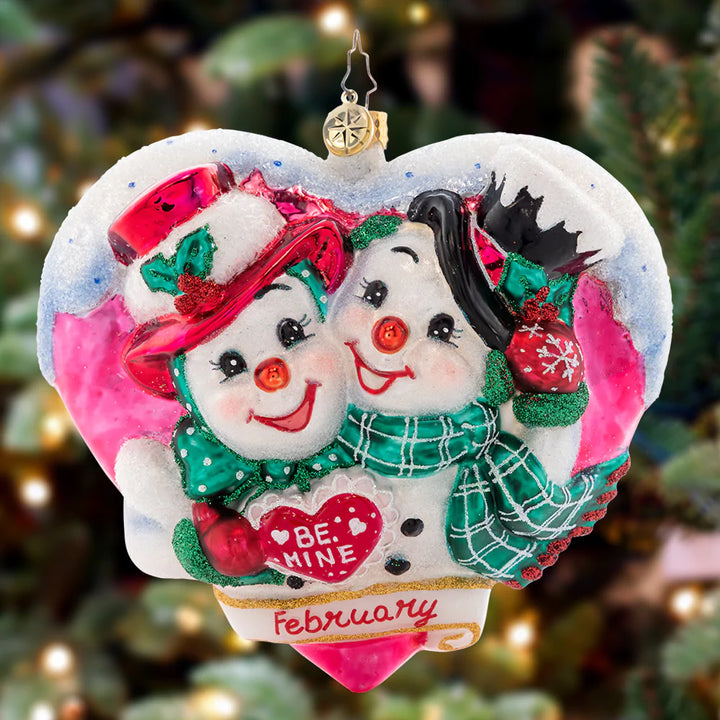 Ornament Description - Forever And Always: Love is in the air! Adorning the second piece in our Ornament of the Month collection, two snowy sweethearts exchange love letters, valuing each other's company this Valentine's Day.