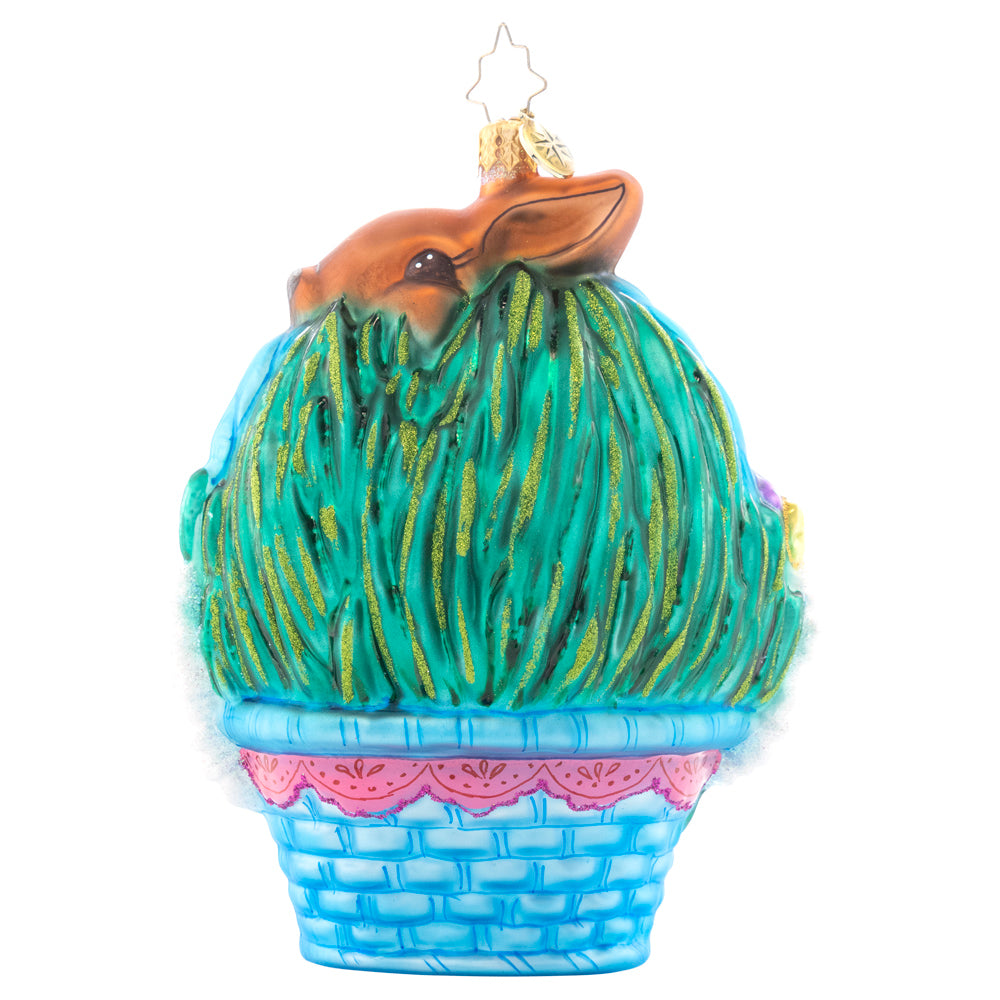 Back - Ornament Description - Happy Easter: The fourth piece in our Ornament of the Month collection will have you hippity-hopping for joy! A blushing bunny has leapt into an Easter basket, joining the hunt for candy-filled eggs.