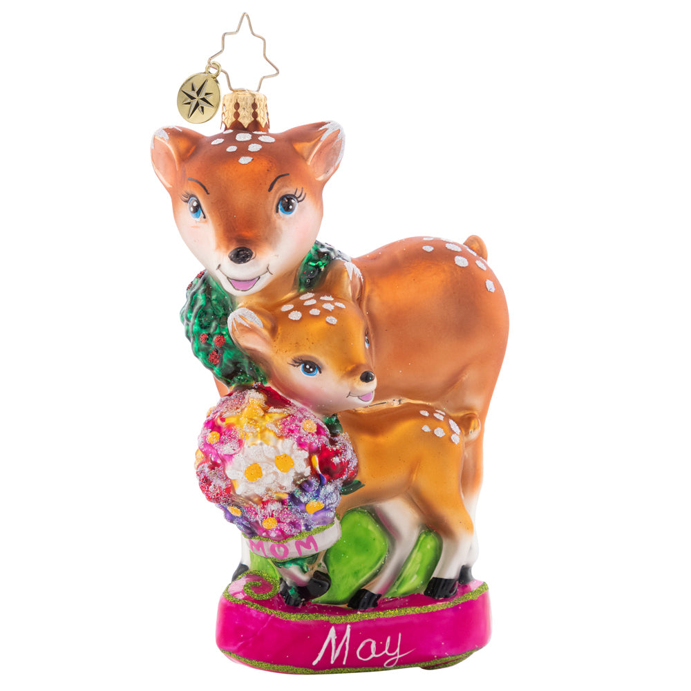 Front - Ornament Description - Celebrate All Moms: This darling mama doe and her baby deer share a sweet moment, sniffing spring flowers together. The fifth piece in our Ornament of the Month collection is just as sweet as the mothers it honors!