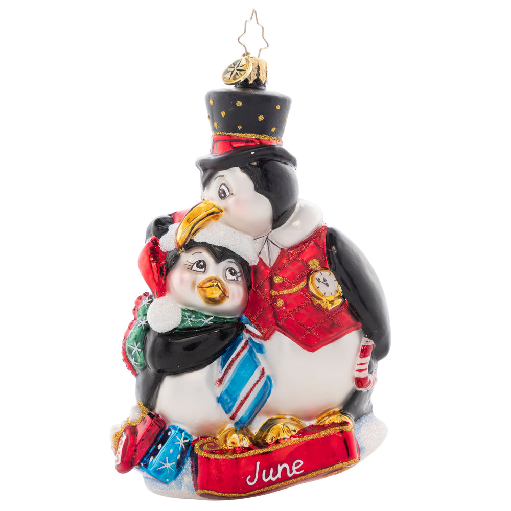 Front - Ornament Description - Here's to the Dads: This dapper dad penguin gives his kiddo a playful peck as they celebrate a fun Father's Day. The sixth piece in our Ornament of the Month collection celebrates dad!