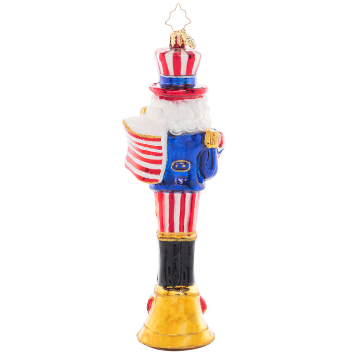 Back - Ornament Description - Fireworks For The Fourth: Celebrate the land of the free with this patriotic nutcracker! The seventh piece in our Ornament of the month collection proudly sports a festive suit of red, white, and blue.