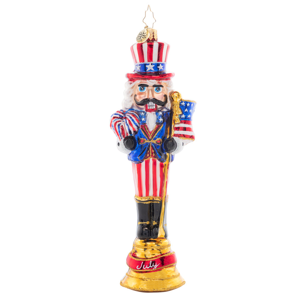 Front - Ornament Description - Fireworks For The Fourth: Celebrate the land of the free with this patriotic nutcracker! The seventh piece in our Ornament of the month collection proudly sports a festive suit of red, white, and blue.