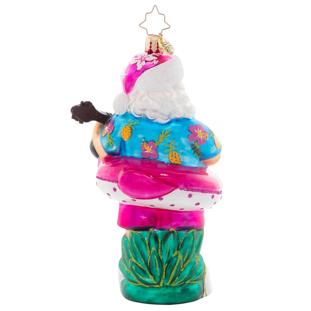 Back - Front - Ornament Description - Beating the Heat: Santa is soaking up some summer sun, giving his ukulele a sound strum. As the eighth piece in our Ornament of the Month collection, he is here to savor summer.